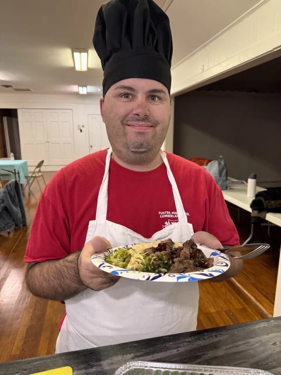 Move Academia cooking workshop member with their steak and broccoli plate