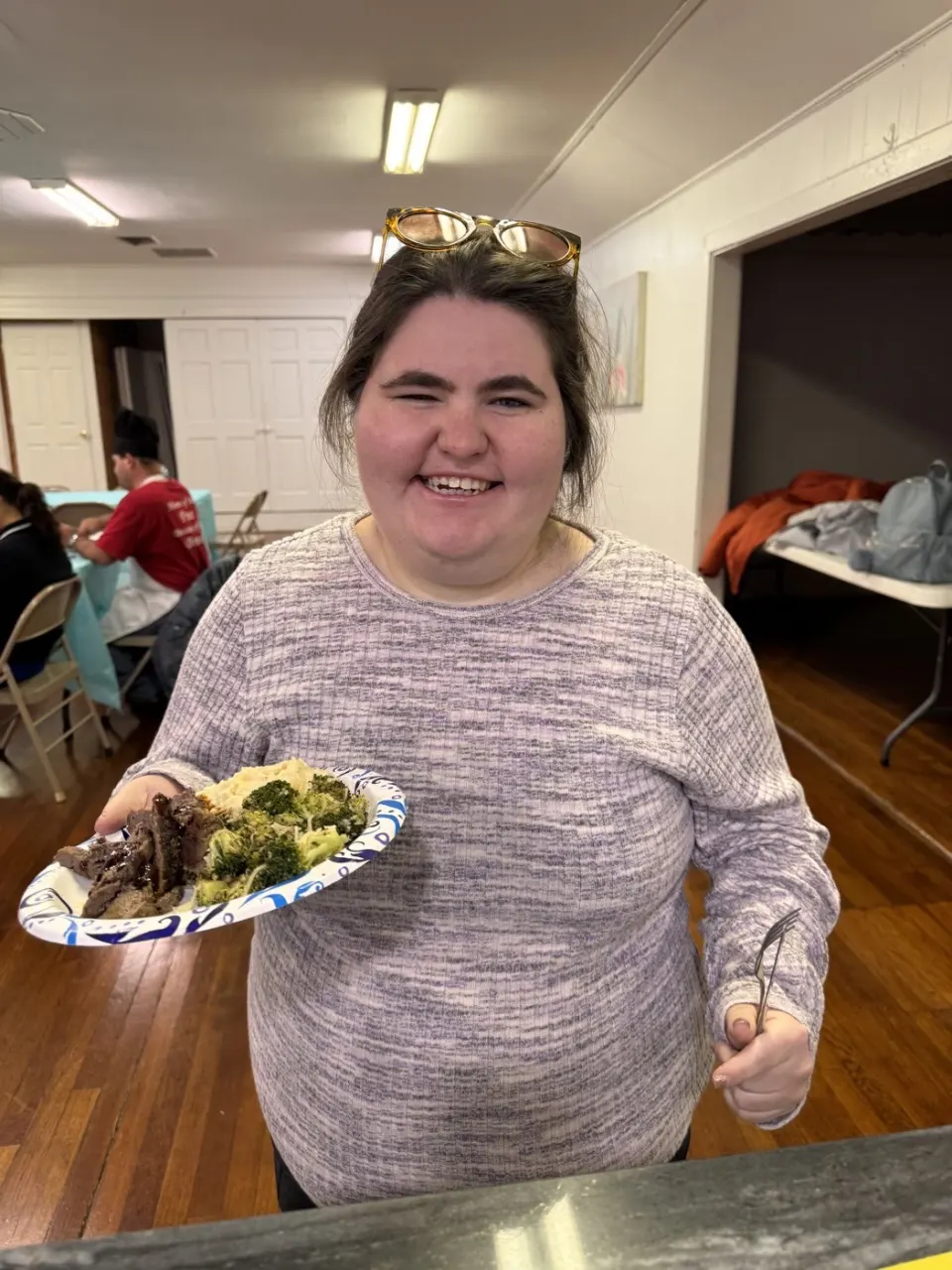 Move Academia cooking workshop member proudly showing their finished meal