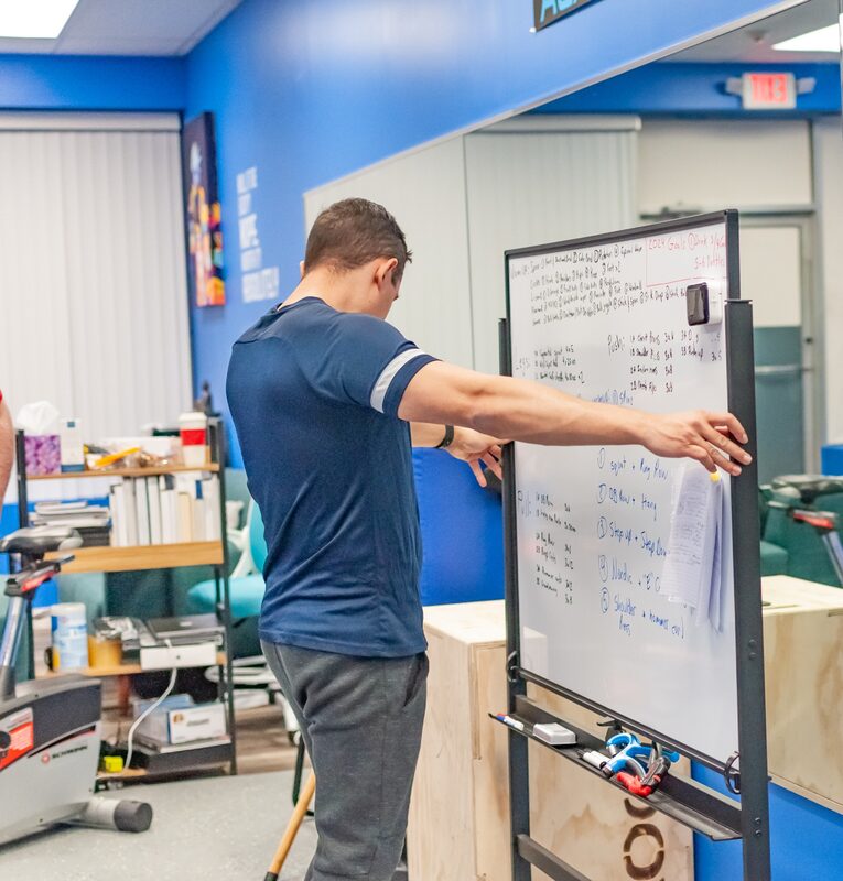 Workout programming on whiteboard
